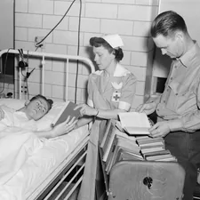 14-1011-042 print 8x10 b&w Mobile library. Red Cross Nurse assists patients with books. [Recreation][Nurses][Patients]Quantico, VA Navy Medicine Historical Files Collection - Facilities related to Ultimate Guide to Choosing the Perfect Bed in a Bag Set