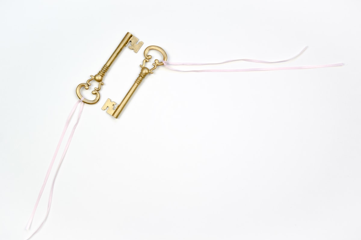 2 golden keys with pink ribbon | for more free images + business resources visit dragonflyave.com/free-goods related to Unlock the Secrets of DIY Valances: Free Sewing Patterns for Every Room