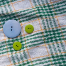 3 buttons on a piece of plaid cotton fabric. related to Blue Plaid Valance