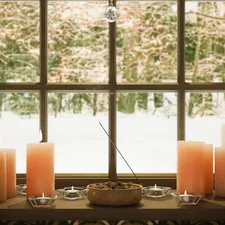 A 3D rendering of candles and chestnuts infront of the window on a winters day related to Exploring the Elegance of Window Treatment Valance Styles