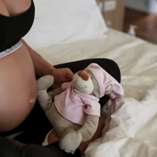 a baby in a diaper related to The Lowdown On Pregnancy Bed Rest: What You Need To Know
