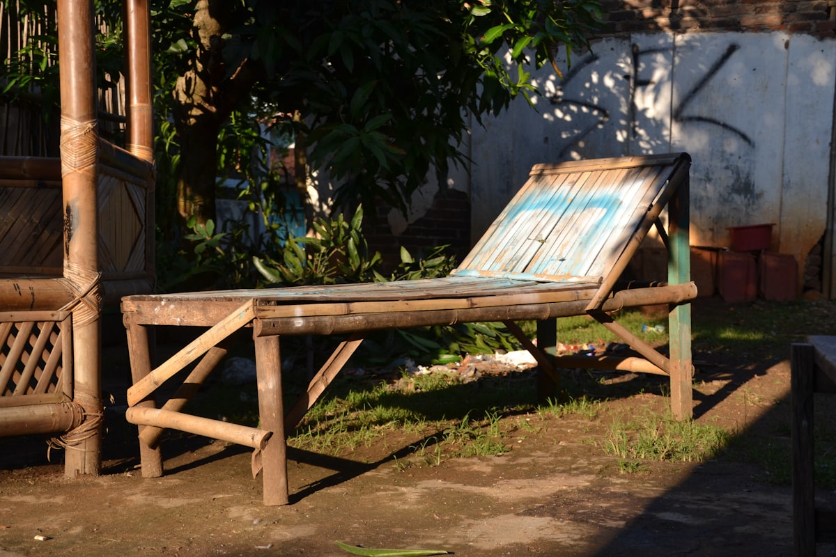 A bamboo chair is placed outdoors in the sun. related to Your Bronze Oasis Awaits: Tanning Beds for Sale Near Me