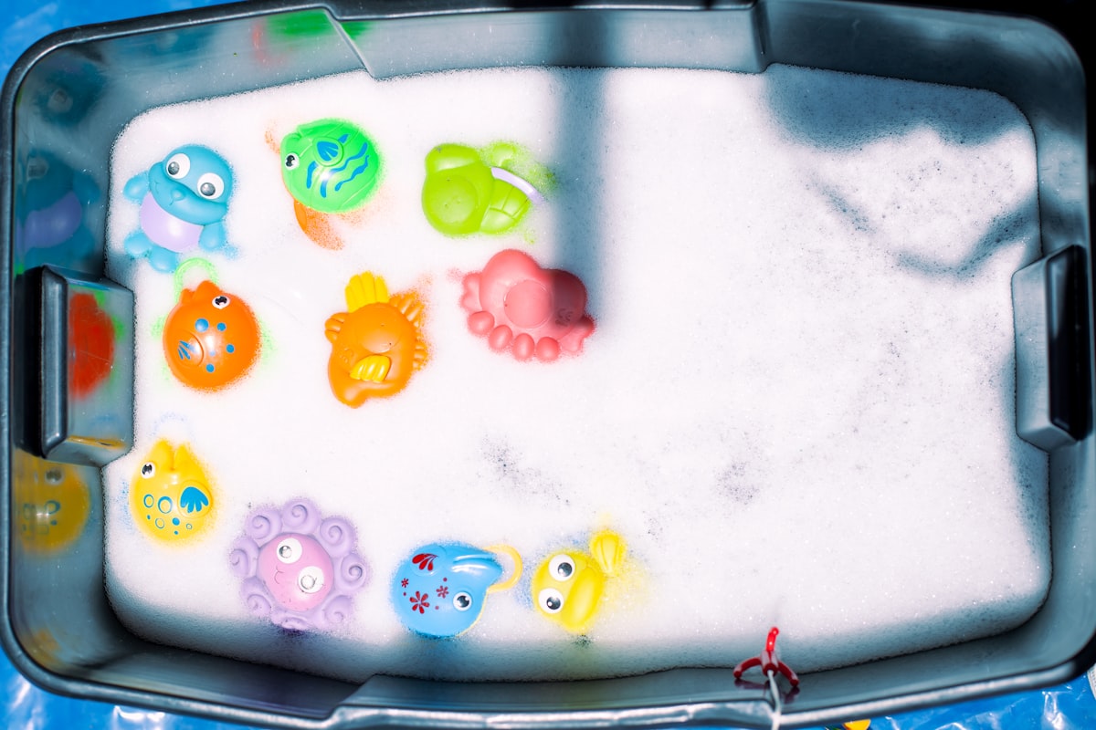 a bath tub filled with lots of different colored toys related to Make a Splash with Bubble Guppies Bedding