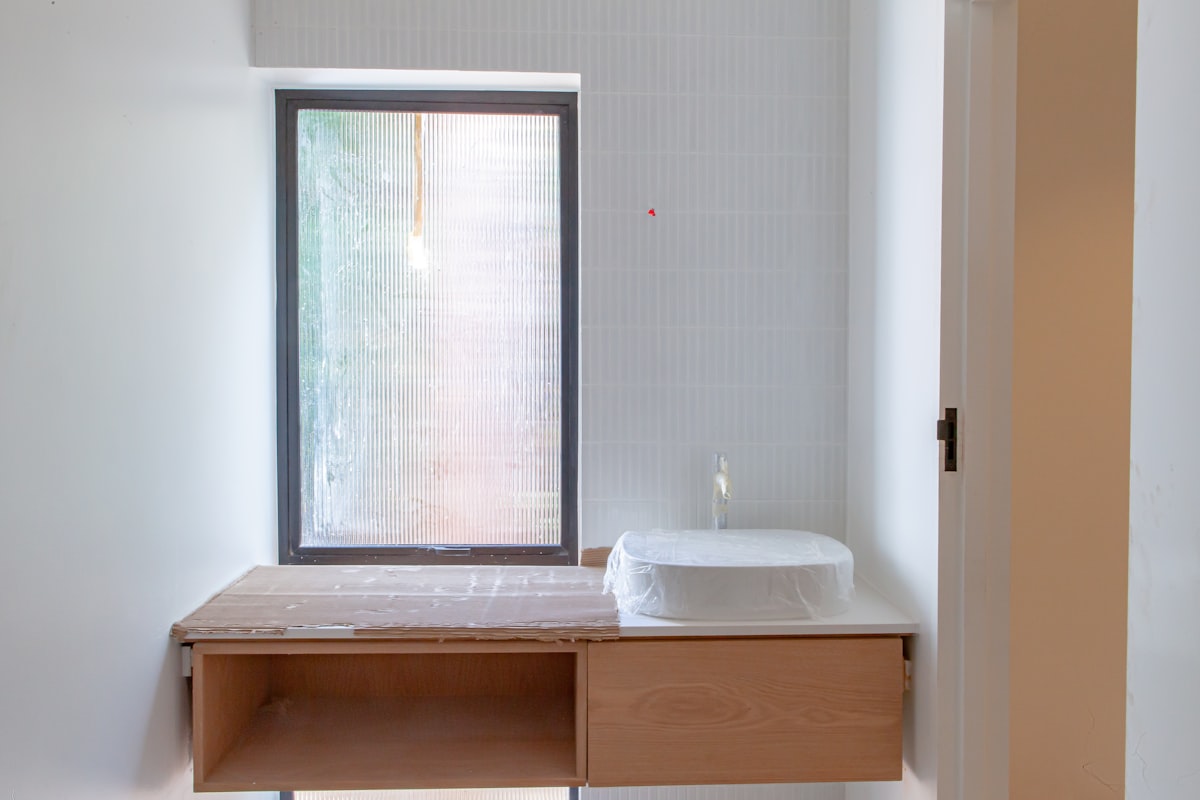 a bathroom with a sink and a window related to Bathroom Window Valances: A Comprehensive Guide