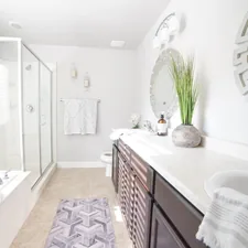 a bathroom with a sink, mirror, and bathtub related to Elevating Bathroom Decor: 3 Key Considerations for Bathroom Curtain Valances