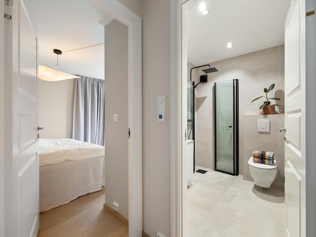 A bathroom with a toilet and a shower in it related to The Ultimate Guide to Bed Bath and Beyond Shower Curtains