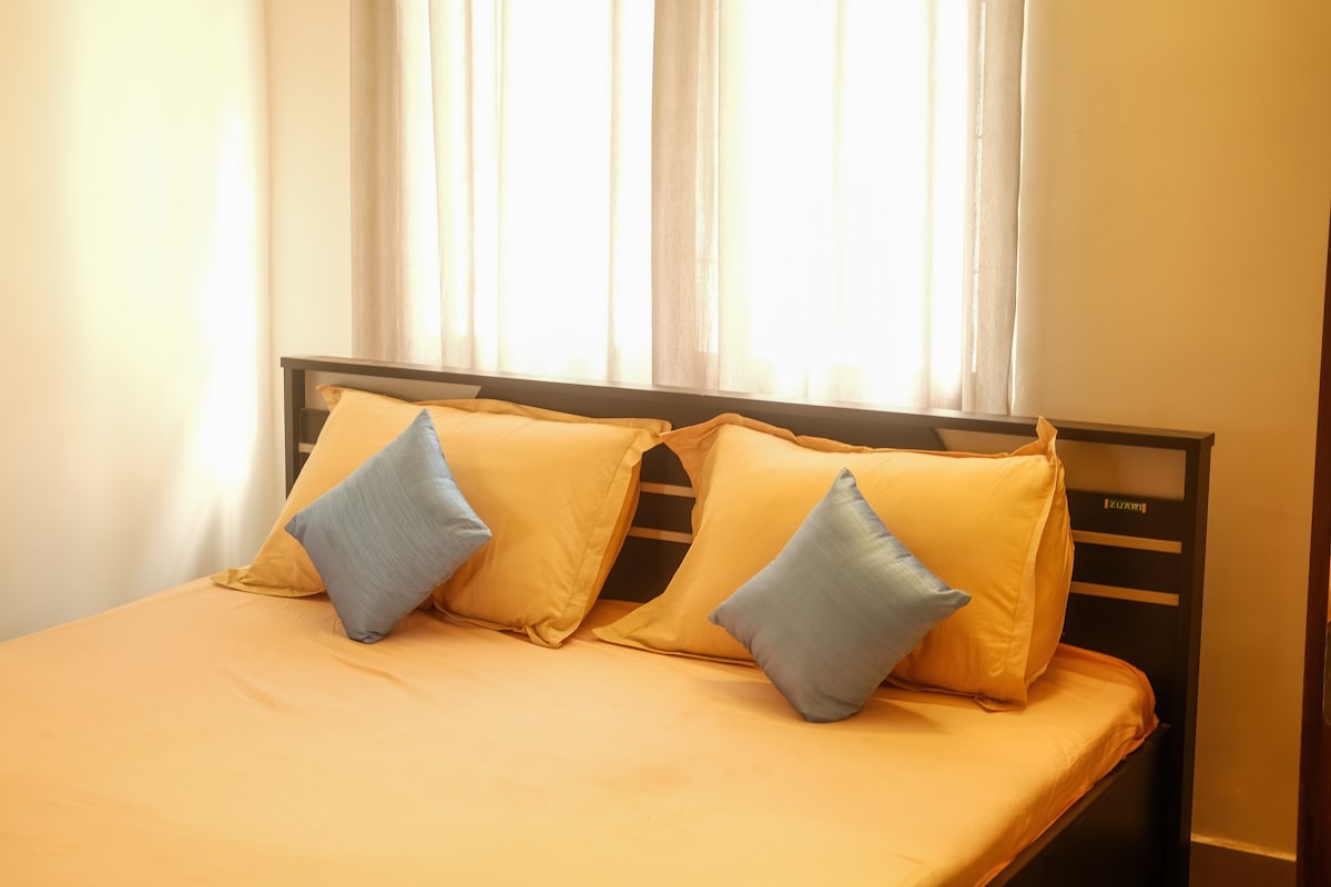 a bed with pillows related to Ultimate Comfort: The Benefits and Buying Guide for a Double Size Bed