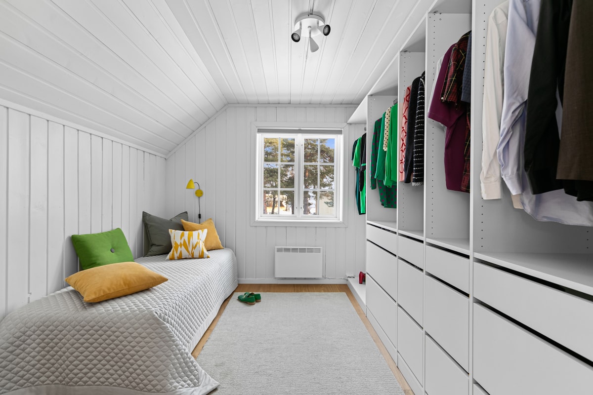 A bedroom with a bed and a closet related to Maximize Space with a Low Loft Bed: The Ultimate Guide