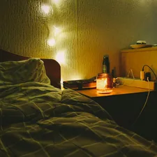 a bedroom with a bed and a night stand related to Brighten Up Your Bedroom with a Yellow Matelasse Coverlet