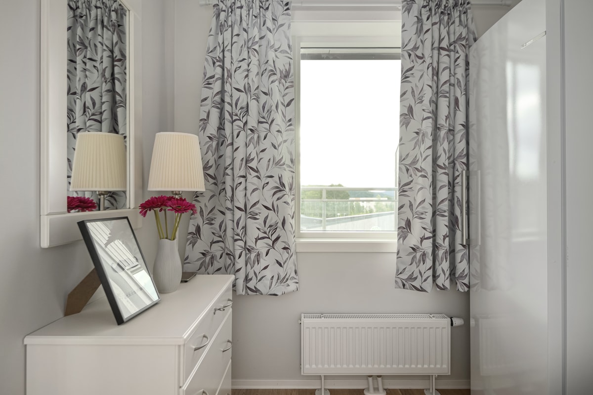 A bedroom with a bed, dresser, mirror and window related to Stunning Curtain Valance Ideas to Elevate Your Home Décor