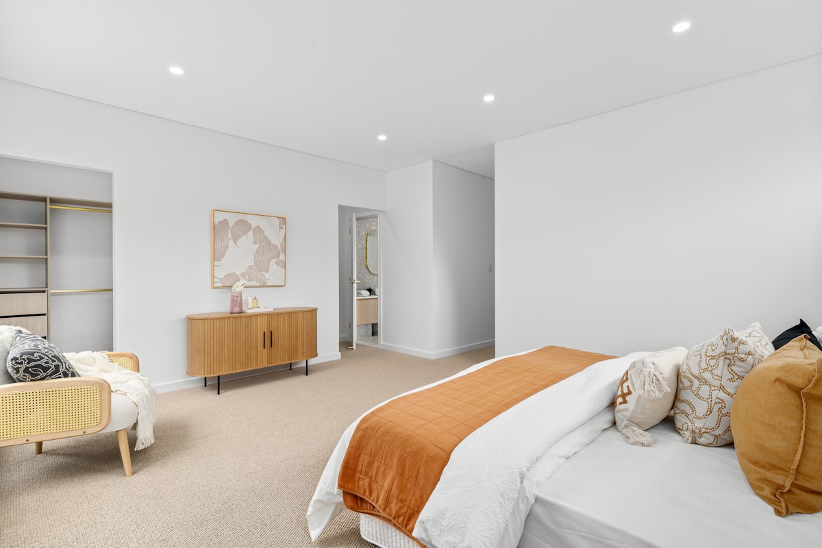 A bedroom with a large bed and white walls related to Level Up Your Space with Stunning Valance Curtain Ideas