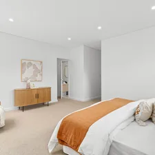 A bedroom with a large bed and white walls related to Level Up Your Space with Stunning Valance Curtain Ideas