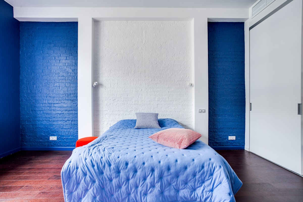 a bedroom with blue walls and a blue bed related to Beautiful Bedroom Ideas with Blue and Coral Bedding