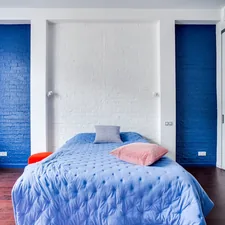 a bedroom with blue walls and a blue bed related to Beautiful Bedroom Ideas with Blue and Coral Bedding
