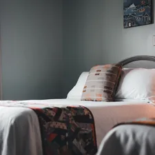 a bedroom with two beds and a window related to Cozy and Stylish: Twin Bed Coverlets to Elevate Your Space