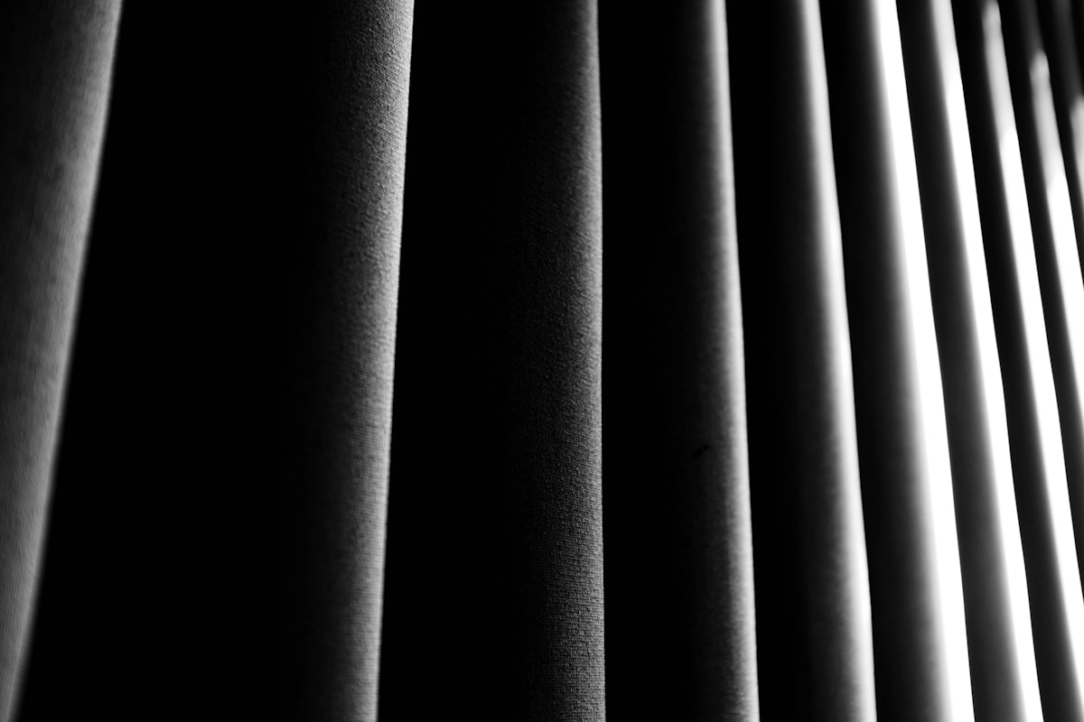 a black and white photo of a curtain related to Black Curtain Valance