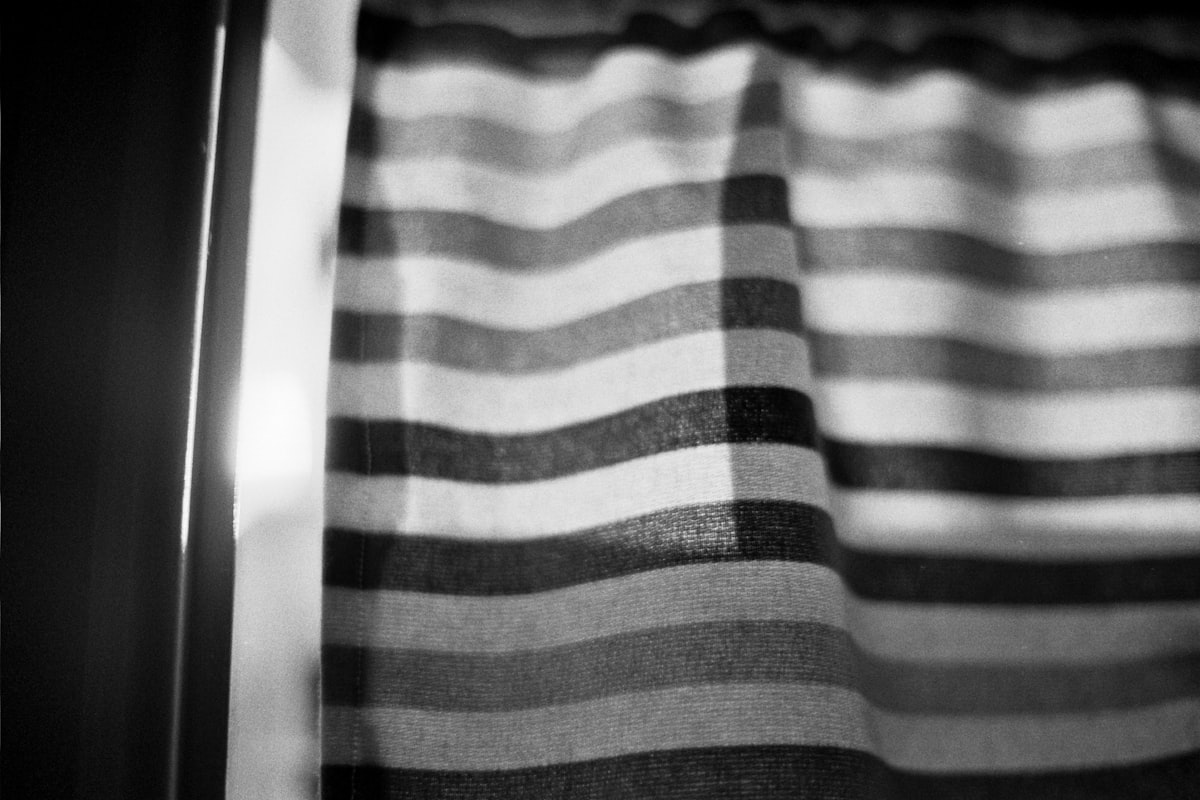 a black and white photo of a curtain related to Black Window Valance