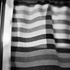 a black and white photo of a curtain related to Black Window Valance