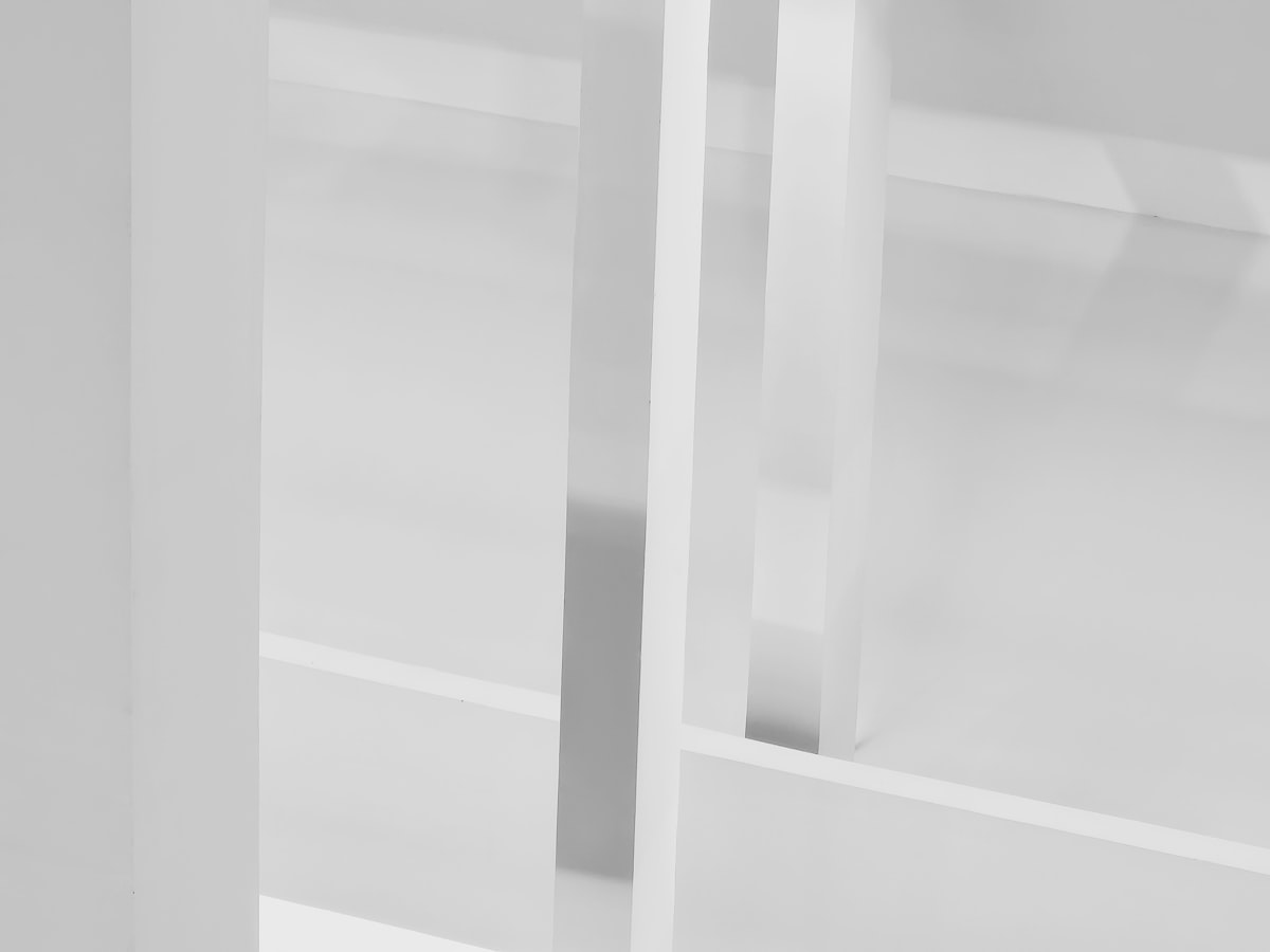 a black and white photo of a glass door related to Upgrade Your Dining Room on a Budget: The Versatility of Cheap White High Gloss Sideboards