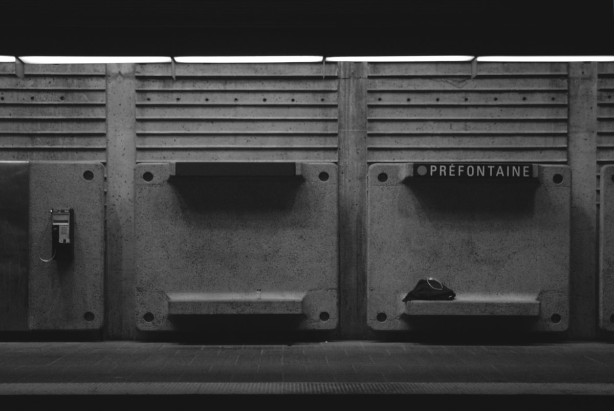 a black and white photo of a row of urinals related to The Perfect Storage Bench for Your Entryway: Organize Your Home in Style