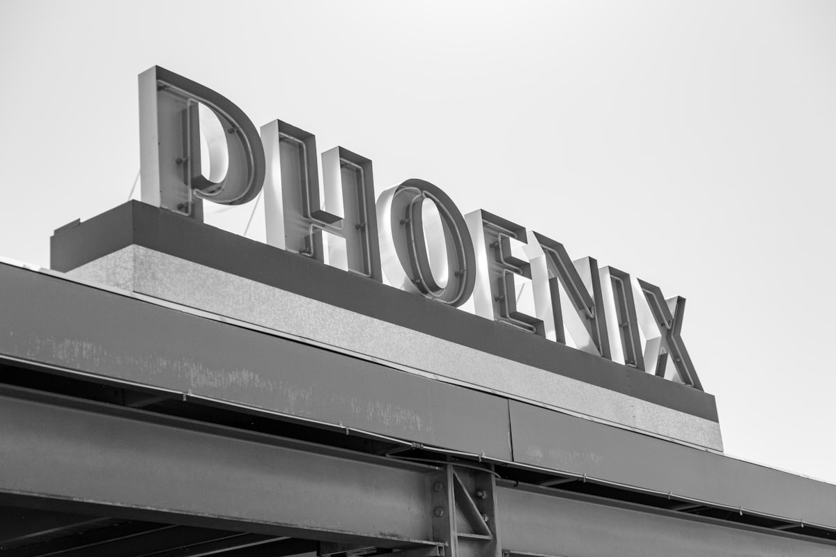 a black and white photo of a sign for a store related to Discover Top Shopping Destinations in Phoenix