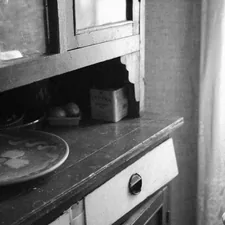 a black and white photo of a sink in a kitchen related to Mastering the Art of Sideboards and Hutch Storage Solutions
