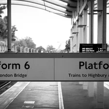 a black and white photo of a train platform related to The Ultimate Guide to Platform Canopy Beds