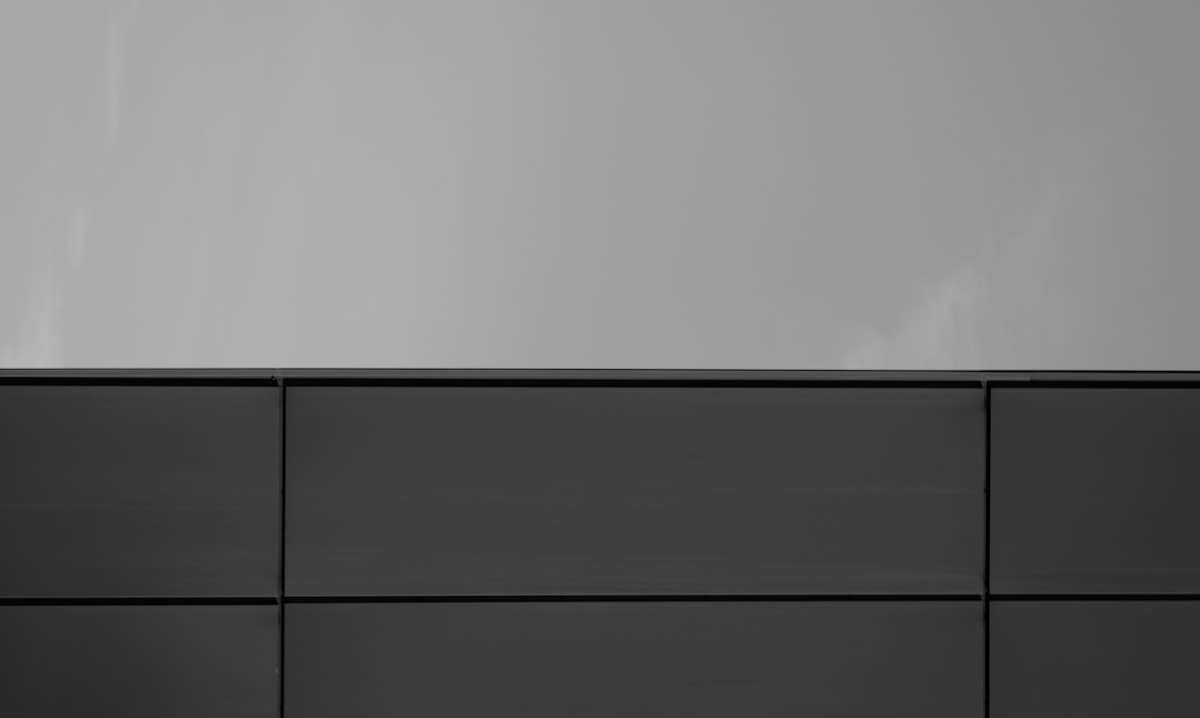 a black and white photo of a wall related to Upgrade Your Dining Room on a Budget: The Versatility of Cheap White High Gloss Sideboards
