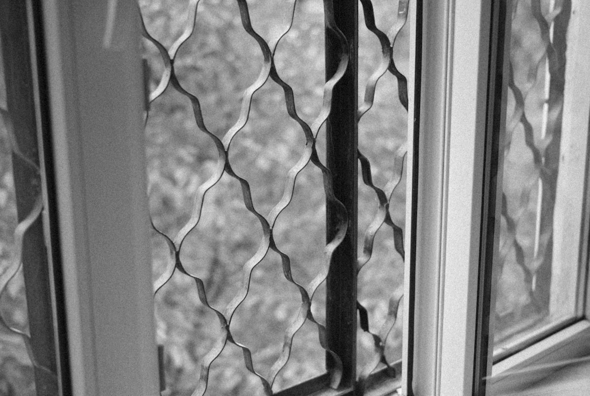 a black and white photo of a window related to Elevate Your Windows with Scalloped Valances