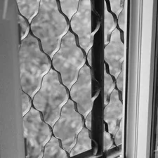 a black and white photo of a window related to Elevate Your Windows with Scalloped Valances