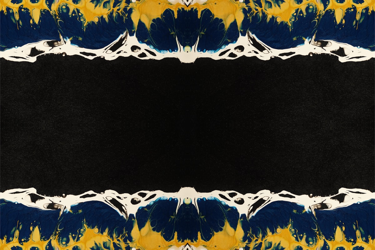 a black background with a yellow and blue design related to Black and Gold Valance