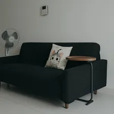 a black couch with a wooden table on top of it related to Cozy Up to Savings: Sofa Bed Sale You Won't Want to Miss