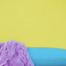 a blue and purple object on a yellow and blue background related to Transform Your Bedroom with Pink and Turquoise Bedding: A Perfect Blend of Color and Comfort