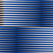 A blue and white abstract background with a diagonal design related to Blue and White Striped Valance
