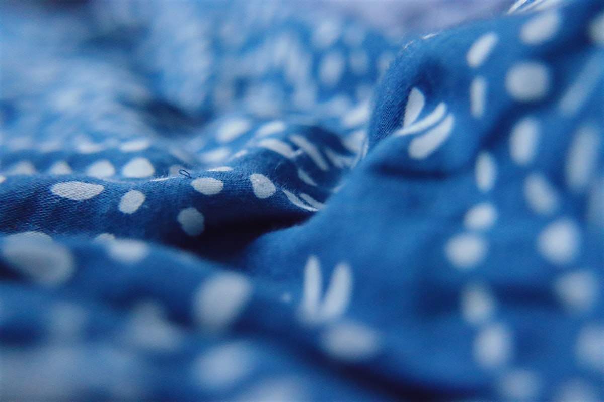 a blue and white blanket with white polka dots related to Blue Coverlets for Beds: Add a Touch of Serenity to Your Bedroom