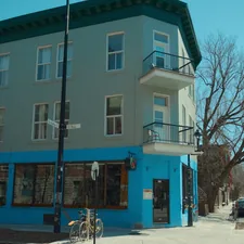 a blue building on a city street corner related to Exploring the Charm of Bed and Breakfasts in Traverse City, MI