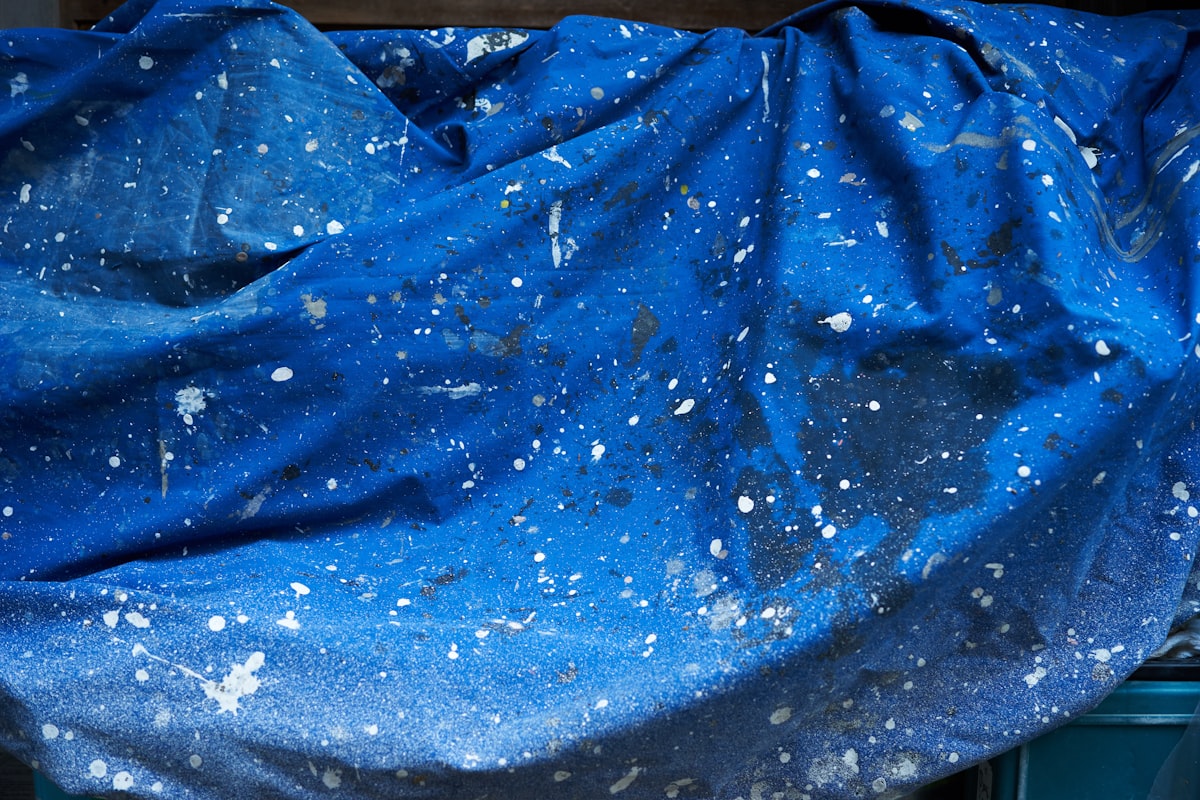 a blue cloth covered in white speckles related to Cosmic Dreams: The Joy of Galaxy Bed Covers