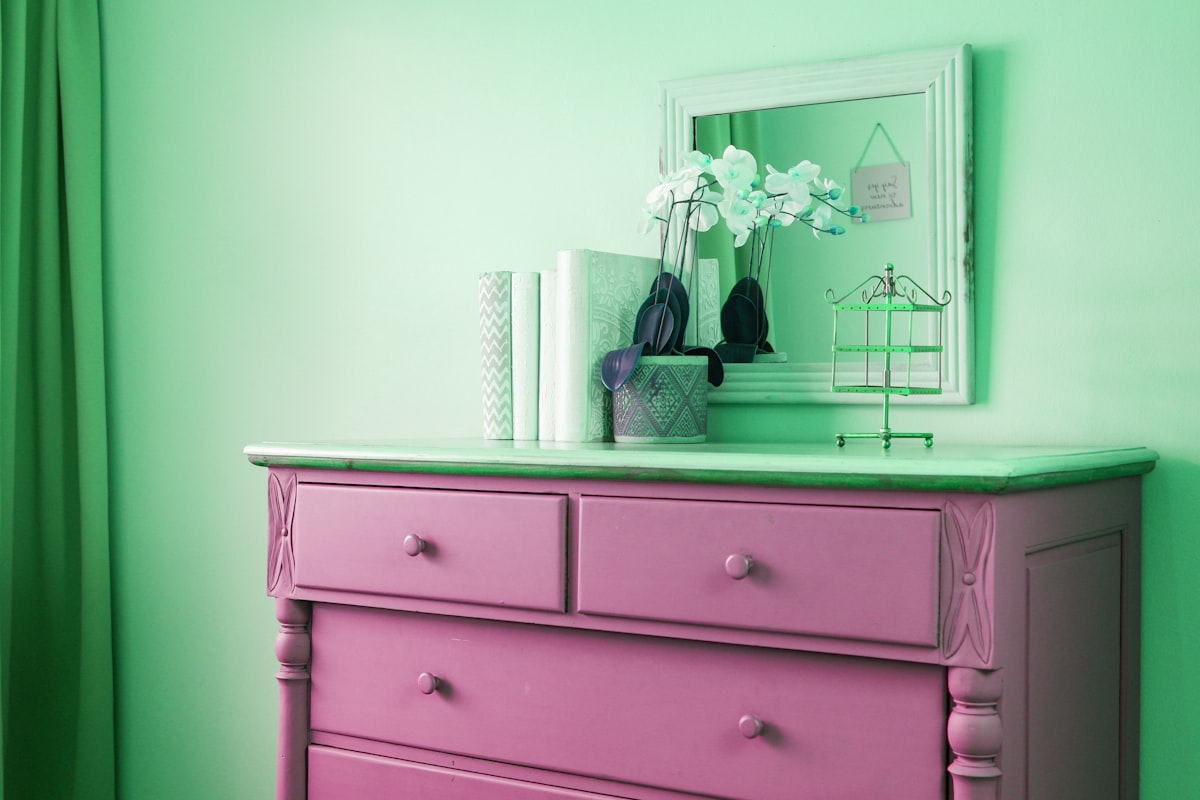a blue dresser with flowers on top of it related to 10 Unique Painted Sideboards and Buffets to Elevate Your Home Decor