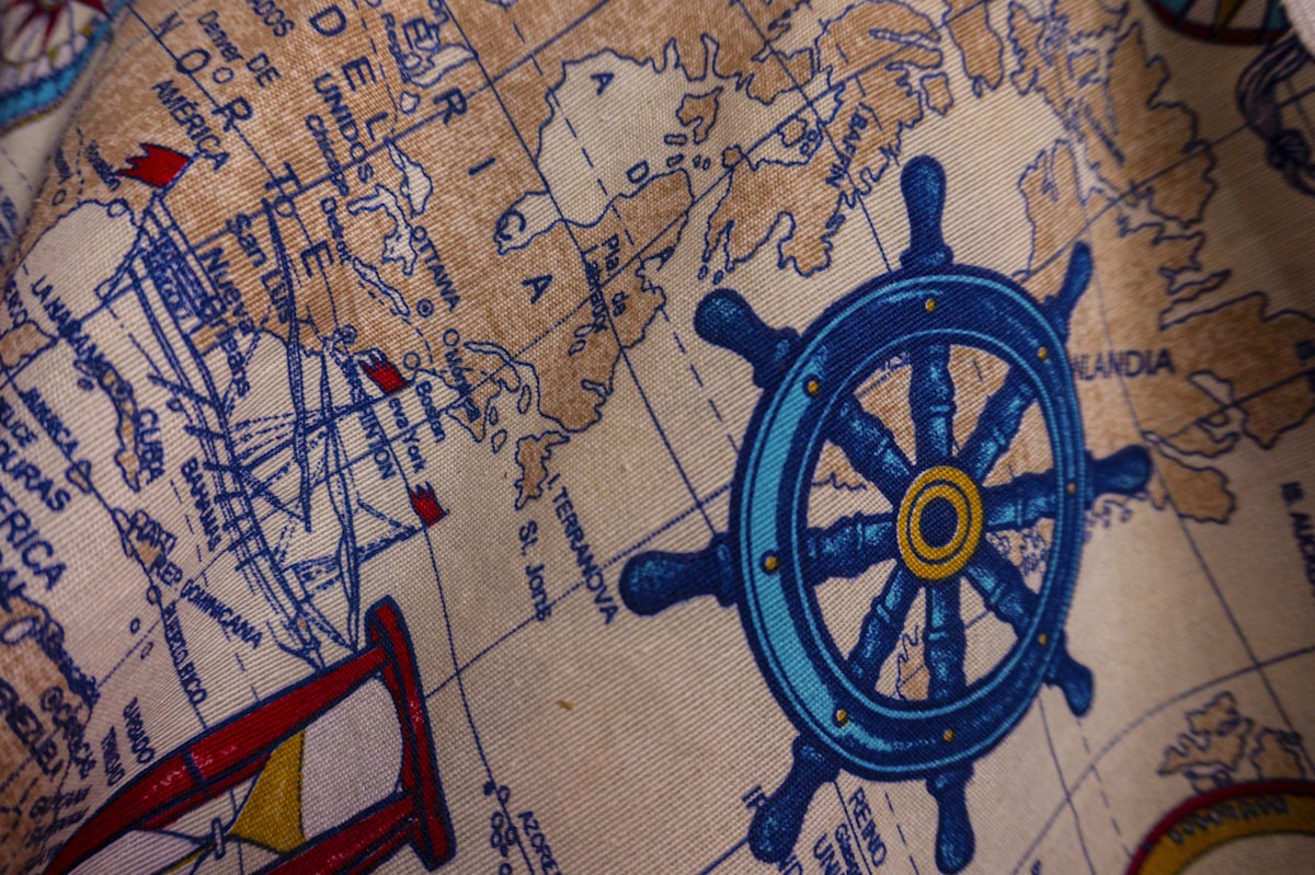 a blue toy on a map related to Nautical Curtain Valance