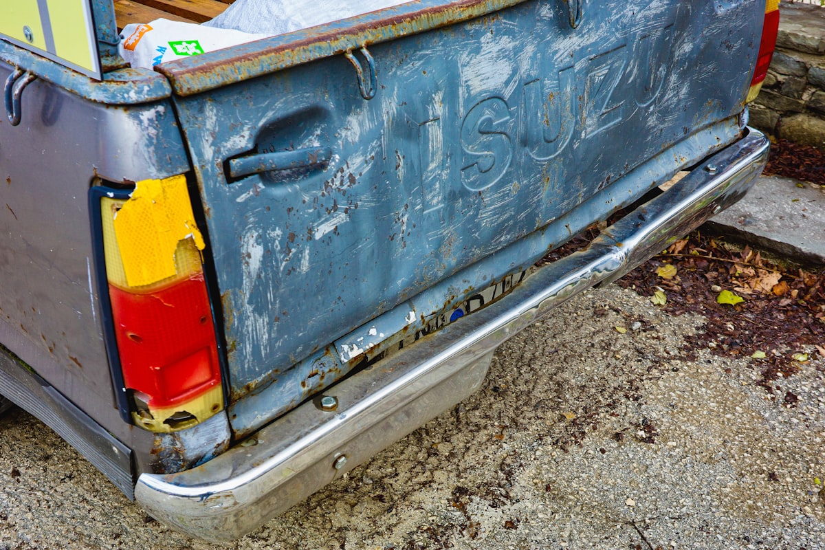 A blue truck with a yellow and red tailgate related to Maximize Your Truck's Utility with a Small Truck Bed Tool Box
