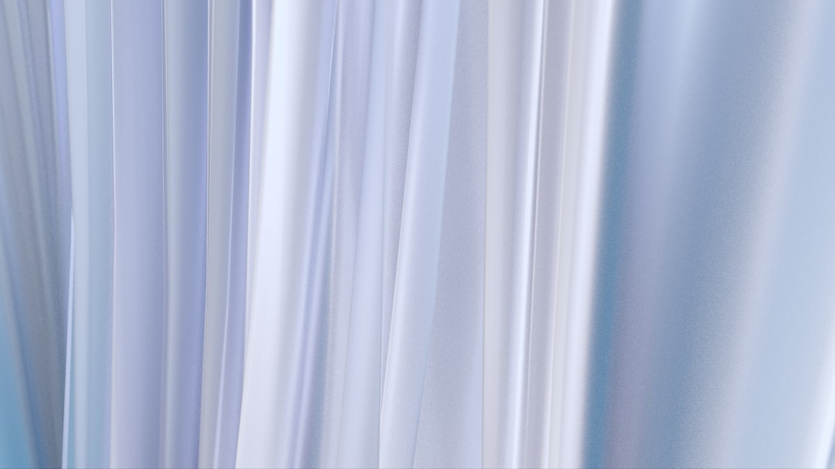 A blurry image of a blue and white curtain related to Light Blue Valance: A Comprehensive Guide