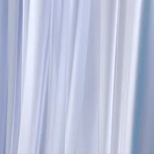 A blurry image of a blue and white curtain related to Light Blue Valance: A Comprehensive Guide