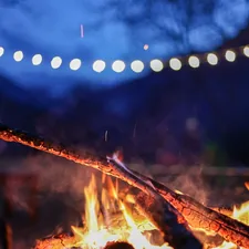 a blurry photo of a fire related to Warm Up Your Outdoor Evenings with a Rustic Clay Chiminea