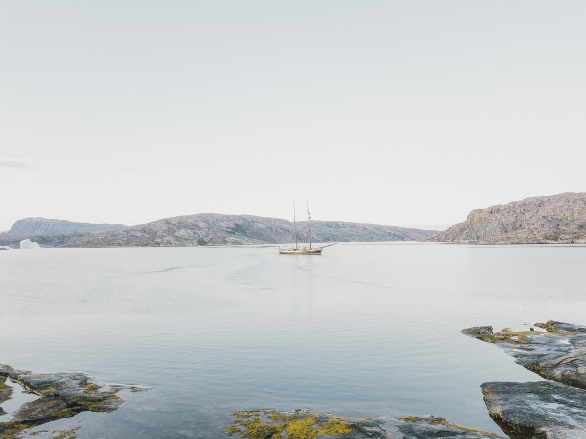 a boat is out on the water near some rocks related to Transform Your Space with a Boat Bunk Bed