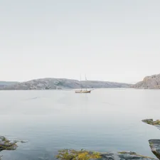 a boat is out on the water near some rocks related to Transform Your Space with a Boat Bunk Bed