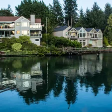 a body of water with houses along it related to Charming Stays in the Emerald City: Discovering Seattle's Best Bed and Breakfasts