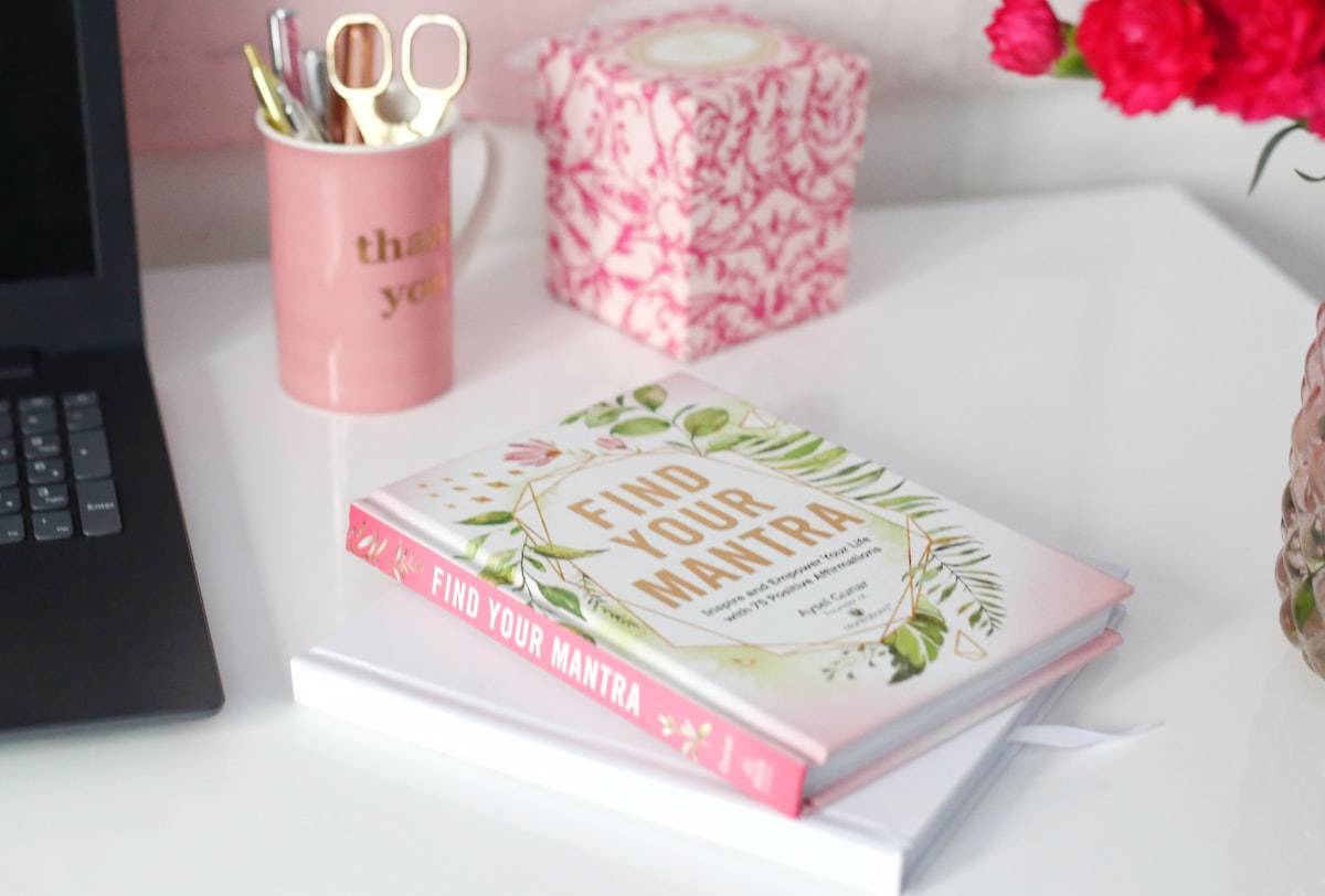 a book and a cup of coffee related to The Ultimate Guide to Martha Stewart Dog Beds: Luxury and Comfort Combined