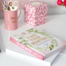 a book and a cup of coffee related to The Ultimate Guide to Martha Stewart Dog Beds: Luxury and Comfort Combined