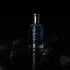 a bottle of vodka sitting on top of a table related to Elevate Your Bedroom with Hugo Boss Bedding: Luxury Meets Comfort