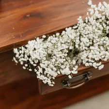 a bouquet of white flowers related to Rustic Sideboards and Buffets: Bringing Charm to Your Home
